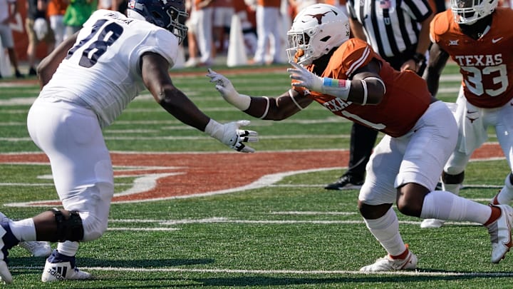 Sep 2, 2023; Austin, Texas, USA; Texas Longhorns linebacker Justice Finkley (1) rushes past Rice Owls wide receiver Ryan Niblett (18) during the second half at Darrell K Royal-Texas Memorial Stadium. Mandatory Credit: Scott Wachter-Imagn Images