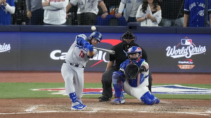 Nov 1, 2025; Toronto, Ontario, CAN; Los Angeles Dodgers third baseman Max Muncy (13) hits a home run against the Toronto Blue Jays in the eighth inning during game seven of the 2025 MLB World Series at Rogers Centre. Mandatory Credit: Kevin Sousa-Imagn Images