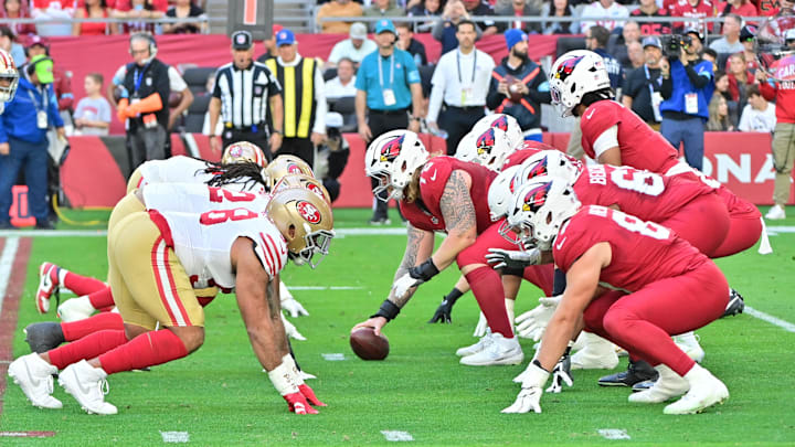 Jan 5, 2025; Glendale, Arizona, USA; The Arizona Cardinals offense squares off against the San Francisco 49ers defense in the first half at State Farm Stadium. Mandatory Credit: Matt Kartozian-Imagn Images