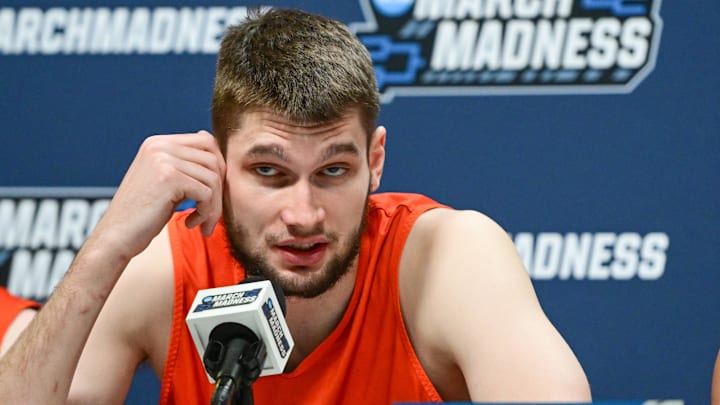Mar 20, 2025; Milwaukee, WI, USA; Illinois Fighting Illini center Tomislav Ivisic (13) speaks at press conference during NCAA Tournament First Round Practice at Fiserv Forum. Mandatory Credit: Benny Sieu-Imagn Images