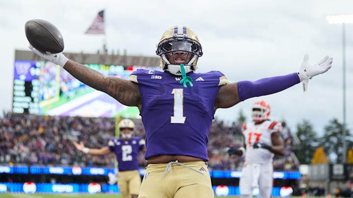Washington running back Jonah Coleman (1) and quarterback Demond Williams Jr. (2) celebrate the former's second receiving touchdown of the season, which was thrown from receiver Denzel Boston to Coleman during the Huskies' 42-25 Week 9 win over the Illinois Fighting Illini on Oct. 25, 2025. Washington running back Jonah Coleman (1) and quarterback Demond Williams Jr. (2) celebrate the former's second receiving touchdown of the season, which was thrown from receiver Denzel Boston to Coleman during the Huskies' 42-25 Week 9 win over the Illinois Fighting Illini on Oct. 25, 2025.