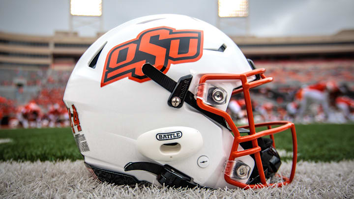 Aug 31, 2024; Stillwater, Oklahoma, USA; Oklahoma State Cowboys helmet sits on the field prior to the game against the South Dakota State Jackrabbits at Boone Pickens Stadium. Mandatory Credit: William Purnell-Imagn Images Aug 31, 2024; Stillwater, Oklahoma, USA; Oklahoma State Cowboys helmet sits on the field prior to the game against the South Dakota State Jackrabbits at Boone Pickens Stadium. Mandatory Credit: William Purnell-Imagn Images