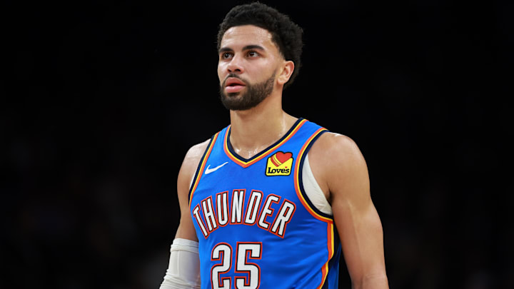 Jan 4, 2026; Phoenix, Arizona, USA; Oklahoma City Thunder guard Ajay Mitchell (25) against the Phoenix Suns at Mortgage Matchup Center. Mandatory Credit: Mark J. Rebilas-Imagn Images