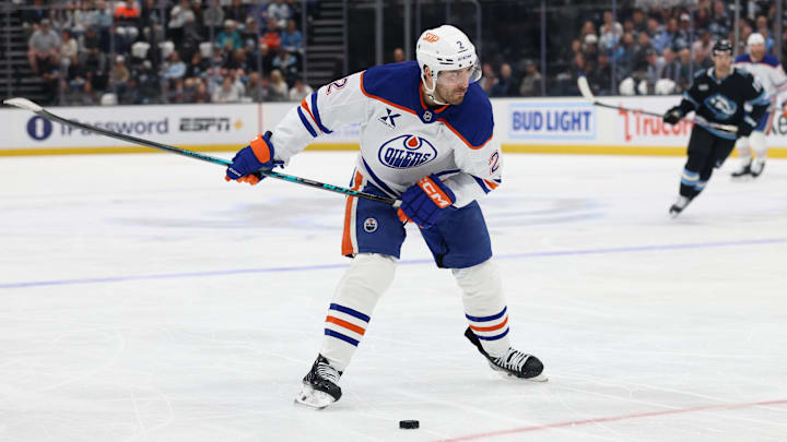 Mar 24, 2026; Salt Lake City, Utah, USA; Edmonton Oilers defenseman Evan Bouchard (2) shoots against the Utah Mammoth during the second period at Delta Center. Mandatory Credit: Rob Gray-Imagn Images Mar 24, 2026; Salt Lake City, Utah, USA; Edmonton Oilers defenseman Evan Bouchard (2) shoots against the Utah Mammoth during the second period at Delta Center. Mandatory Credit: Rob Gray-Imagn Images