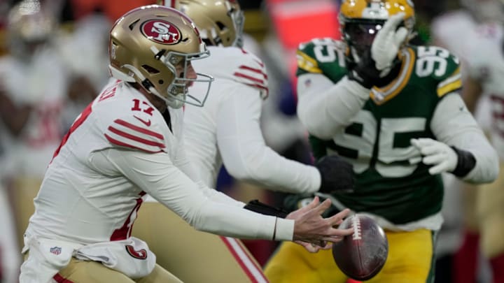 San Francisco 49ers quarterback Brandon Allen (17) recover his own fumble before being sacked by Green Bay Packers linebacker Quay Walker during the first quarter of their game Sunday, November 24, 2024 at Lambeau Field in Green Bay, Wisconsin. San Francisco 49ers quarterback Brandon Allen (17) recover his own fumble before being sacked by Green Bay Packers linebacker Quay Walker during the first quarter of their game Sunday, November 24, 2024 at Lambeau Field in Green Bay, Wisconsin.