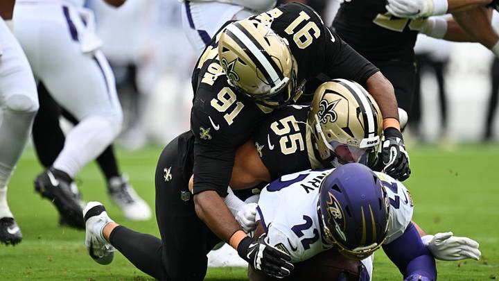 Sep 20, 2026; Baltimore, Maryland, USA; Baltimore Ravens running back Derrick Henry (22) is brought down by New Orleans Saints linebacker Kaden Elliss (55) and defensive line Vernon Broughton (91) in the first quarter at M&T Bank Stadium. Mandatory Credit: Jamie Sabau-Imagn Images Sep 20, 2026; Baltimore, Maryland, USA; Baltimore Ravens running back Derrick Henry (22) is brought down by New Orleans Saints linebacker Kaden Elliss (55) and defensive line Vernon Broughton (91) in the first quarter at M&T Bank Stadium. Mandatory Credit: Jamie Sabau-Imagn Images