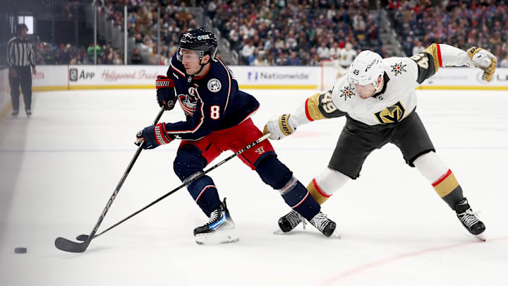 Blue Jackets defenseman Zach Werenski fends off Vegas forward Ivan Barbashev. Blue Jackets defenseman Zach Werenski fends off Vegas forward Ivan Barbashev.