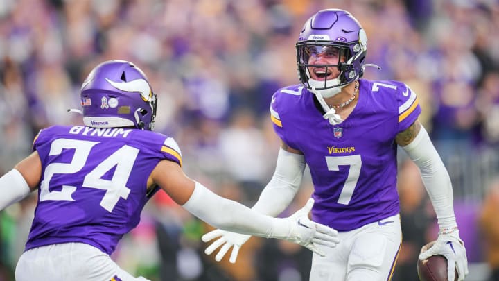 Nov 12, 2023; Minneapolis, Minnesota, USA; Minnesota Vikings cornerback Byron Murphy Jr. (7) celebrates his interception with safety Camryn Bynum (24) against the New Orleans Saints in the fourth quarter at U.S. Bank Stadium. Mandatory Credit: Brad Rempel-USA TODAY Sports
