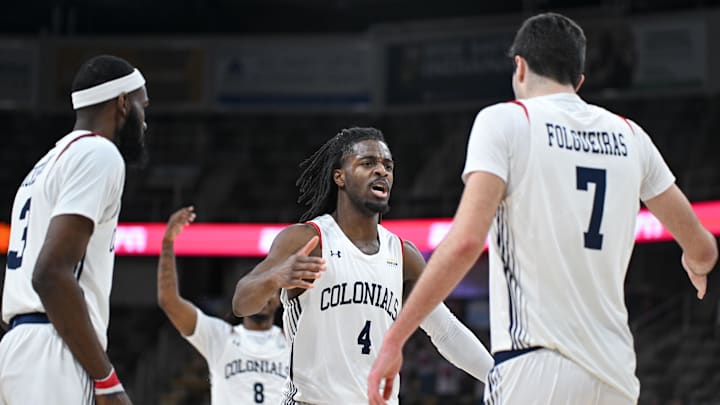 Mar 11, 2025; Indianapolis, IN, USA; Robert Morris Colonials guard Josh Omojafo (4) and Robert Morris Colonials forward Alvaro Folgueiras (7) celebrate after a play during the second half against the Youngstown State Penguins at Corteva Coliseum. Mandatory Credit: Robert Goddin-Imagn Images