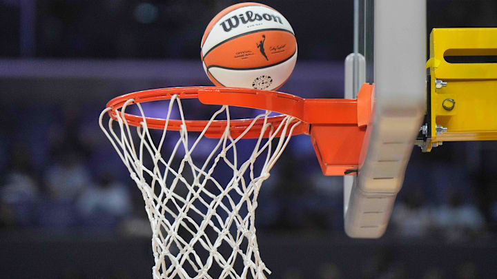 Jul 5, 2024; Los Angeles, California, USA; A WIlson official WNBA Evo NXT basketball approaches the rim and the net at Crypto.com Arena. Mandatory Credit: Kirby Lee-Imagn Images