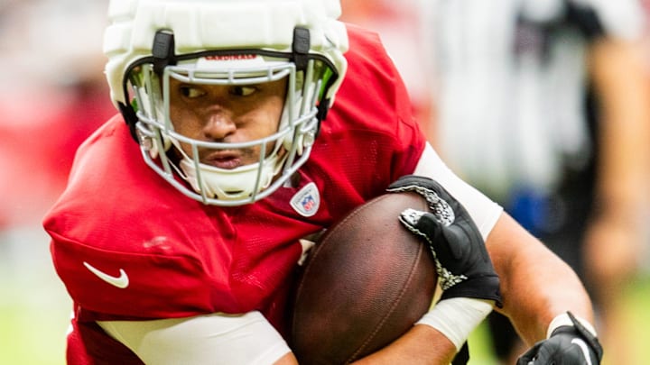 TE Noah Togiai runs with the ball during the Arizona Cardinals' annual Red & White practice at TE Noah Togiai runs with the ball during the Arizona Cardinals' annual Red & White practice at