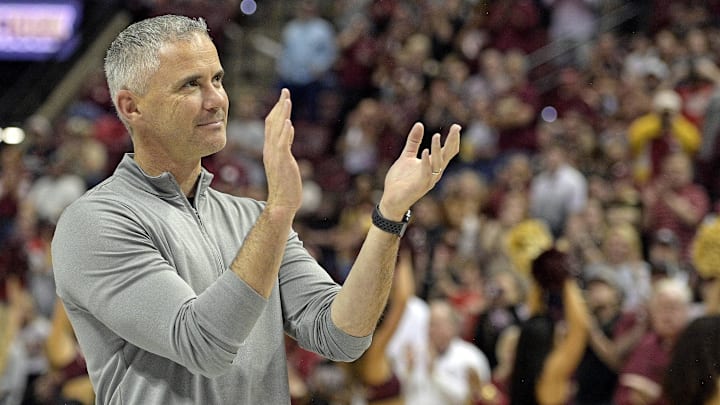 Mar 9, 2024; Tallahassee, Florida, USA; Florida State Seminoles head football coach Mike Norvell accepts the Bear Bryant coach of the Year award during a media timeout of a basketball game against the Miami Hurricanes at Donald L. Tucker Center. Mandatory Credit: Melina Myers-USA TODAY Sports