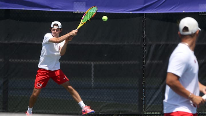 Linn-Mar’s Garrett Bauermeister returns the ball at the IHSAA Boys State Tennis Tournament Wednesday, May 22, 2024 in Iowa City, Iowa.
