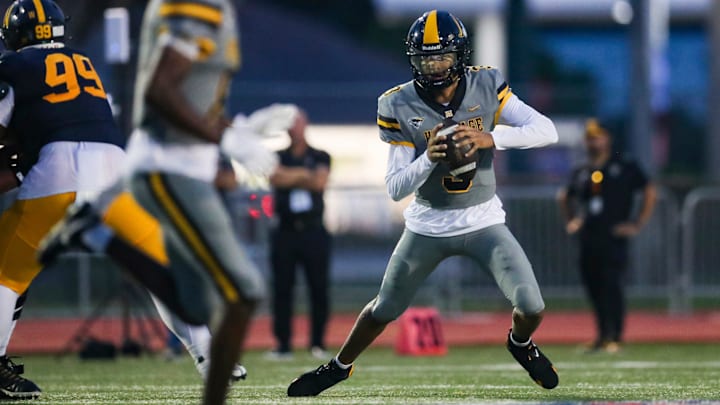 American Heritage Patriots quarterback Dia Bell (3) scrambles in the backfield during the first quarter of a game against the Naples Golden Eagles at Staver Field in Naples on Friday, Sept. 13, 2024.