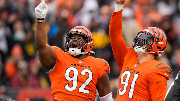 Cincinnati Bengals defensive end Trey Hendrickson (91) celebrates a sack with defensive tackle BJ Hill (92) in the first quarter of the NFL Week 12 game between the Cincinnati Bengals and the Pittsburgh Steelers at Paycor Stadium in Cincinnati on Sunday, Nov. 26, 2023.