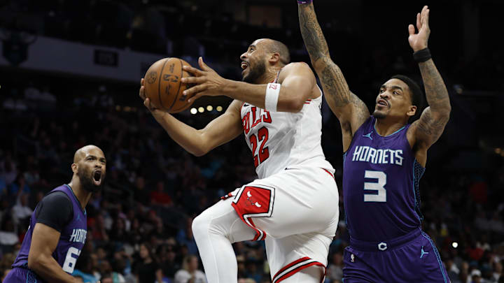 Apr 6, 2025; Charlotte, North Carolina, USA; Chicago Bulls forward Talen Horton-Tucker (22) drives to the basket past Charlotte Hornets guard DaQuan Jeffries (3) during the second half at Spectrum Center. Mandatory Credit: Nell Redmond-Imagn Images