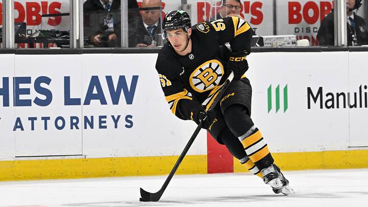 Sep 29, 2025; Boston, Massachusetts, USA;  Boston Bruins center Matthew Poitras (51) carries the puck through the neutral zone during the first period against the Philadelphia Flyers at TD Garden. Mandatory Credit: Eric Canha-Imagn Images
