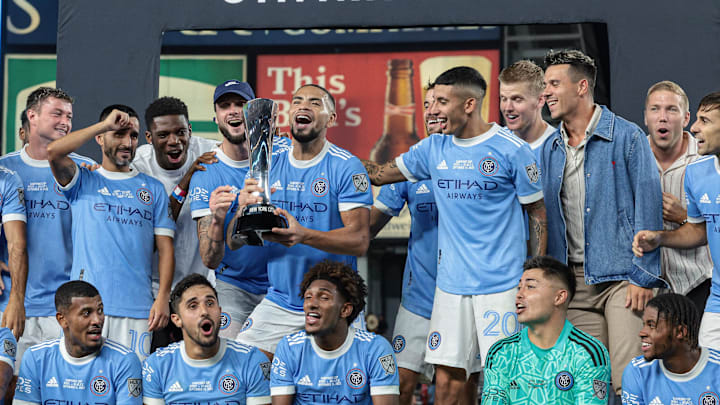 Sep 14, 2022; New York, NY, USA; New York City FC players celebrate with the trophy after defeating