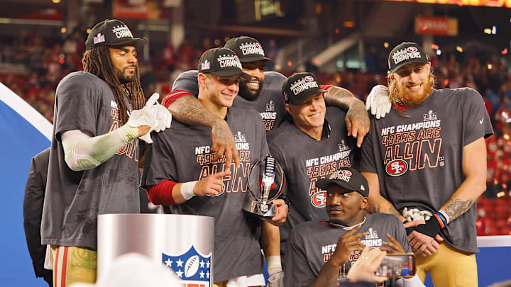 Jan 28, 2024; Santa Clara, California, USA; (Left to right) San Francisco 49ers linebacker Fred Warner (54), quarterback Brock Purdy (13), offensive tackle Trent Williams (71), running back Christian McCaffrey (23), wide receiver Deebo Samuel (19), and tight end George Kittle (85) celebrate after winning the NFC Championship football game against the Detroit Lions at Levi's Stadium. Mandatory Credit: Kelley L Cox-Imagn Images