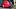 Red Washington Nationals hat on top of a black mitt Red Washington Nationals hat on top of a black mitt