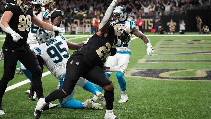 Dec 14, 2025; New Orleans, Louisiana, USA; New Orleans Saints running back Devin Neal (24) reacts after scoring a touchdown during the second quarter against the Carolina Panthers at Caesars Superdome. Mandatory Credit: Matthew Hinton-Imagn Images