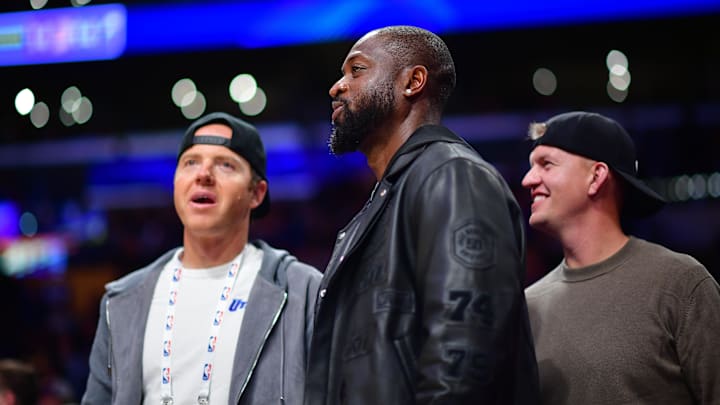 Nov 19, 2024; Los Angeles, California, USA; Utah Jazz minority owner Dwyane Wade with majority owner Ryan Smith (left) watch game action against the Los Angeles Lakers during the second half at Crypto.com Arena. Mandatory Credit: Gary A. Vasquez-Imagn Images Nov 19, 2024; Los Angeles, California, USA; Utah Jazz minority owner Dwyane Wade with majority owner Ryan Smith (left) watch game action against the Los Angeles Lakers during the second half at Crypto.com Arena. Mandatory Credit: Gary A. Vasquez-Imagn Images