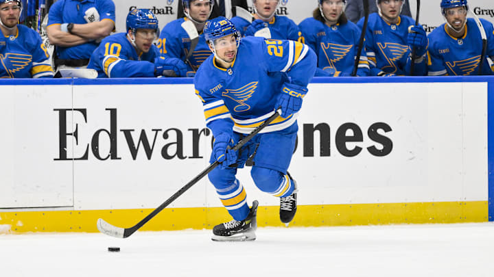 Jan 2, 2026; St. Louis, Missouri, USA; St. Louis Blues right wing Jordan Kyrou (25) controls the puck against the Vegas Golden Knights during the second period at Enterprise Center. Mandatory Credit: Jeff Curry-Imagn Images