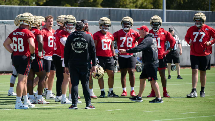 Jul 27, 2023; Santa Clara, CA, USA; San Francisco 49ers offensive line coach and run game coordinator Chris Foerster talks to a group of offensive lineman during training camp at the SAP Performance Facility. Mandatory Credit: Robert Edwards-USA TODAY Sports