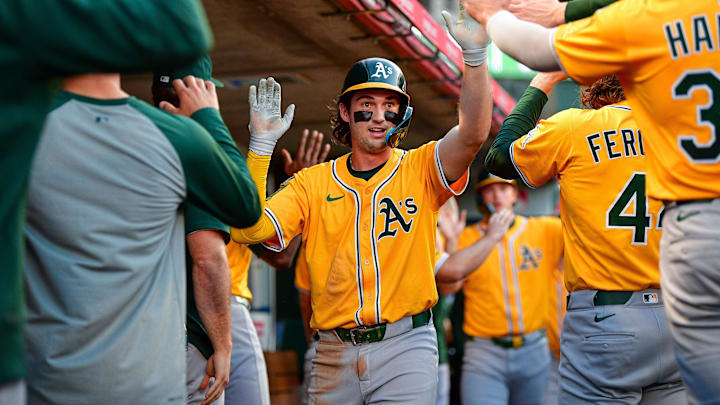 Sep 6, 2025; Anaheim, California, USA; Athletics shortstop Jacob Wilson (5) is greeted after scoring a run against the Los Angeles Angels. during the first inning at Angel Stadium. Mandatory Credit: Gary A. Vasquez-Imagn Images
