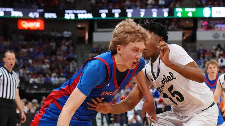Wisconsin Lutheran's Kager Knueppel (1) breaks past Madison Memorial's Lavonte Johnson (15) during the WIAA Division 1 boys state championship basketball game on Saturday, March 21, 2026, at the Kohl Center in Madison, Wisconsin. Wisconsin Lutheran's Kager Knueppel (1) breaks past Madison Memorial's Lavonte Johnson (15) during the WIAA Division 1 boys state championship basketball game on Saturday, March 21, 2026, at the Kohl Center in Madison, Wisconsin.