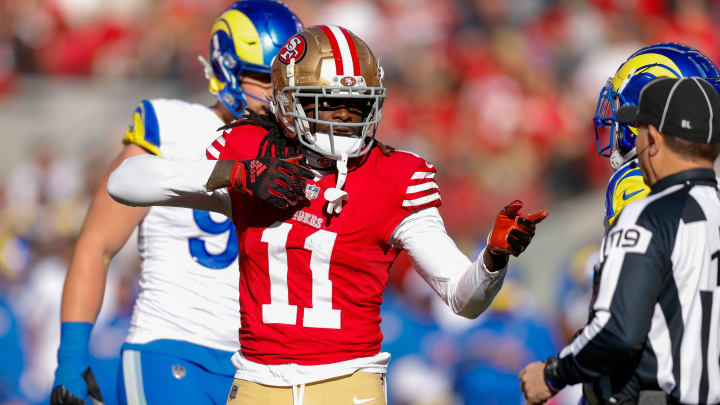 Jan 7, 2024; Santa Clara, California, USA; San Francisco 49ers wide receiver Brandon Aiyuk (11) celebrates after a play against the Los Angeles Rams during the first quarter at Levi's Stadium. Mandatory Credit: Sergio Estrada-USA TODAY Sports