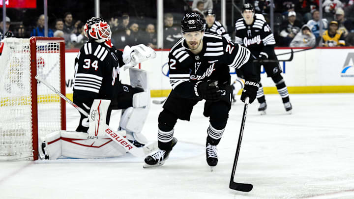 Apr 11, 2025; Newark, New Jersey, USA; New Jersey Devils defenseman Brett Pesce (22) pursues a loose puck during the third period against the Pittsburgh Penguins at Prudential Center. Mandatory Credit: John Jones-Imagn Images Apr 11, 2025; Newark, New Jersey, USA; New Jersey Devils defenseman Brett Pesce (22) pursues a loose puck during the third period against the Pittsburgh Penguins at Prudential Center. Mandatory Credit: John Jones-Imagn Images