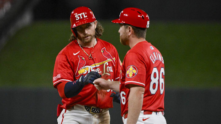 Sep 19, 2025; St. Louis, Missouri, USA;  St. Louis Cardinals second baseman Brendan Donovan (33) celebrate with first base coach Packy Elkins (86)after hitting a single against the Milwaukee Brewers during the fifth inning at Busch Stadium. Mandatory Credit: Jeff Curry-Imagn Images