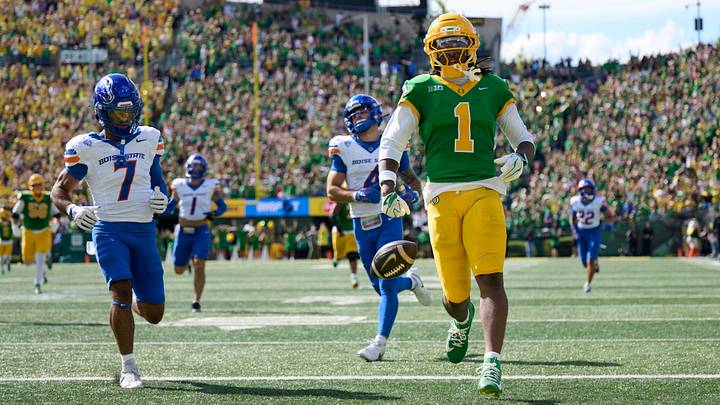 Oregon wide receiver Dakorien Moore scores a touchdown against Boise State. Oregon wide receiver Dakorien Moore scores a touchdown against Boise State.