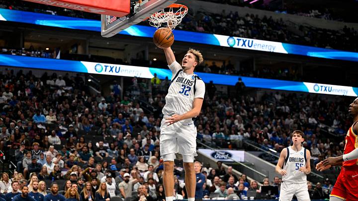 Oct 16, 2026; Dallas, Texas, USA; Dallas Mavericks forward Cooper Flagg (32) dunks the ball during the game between the Mavericks and the Hawks 