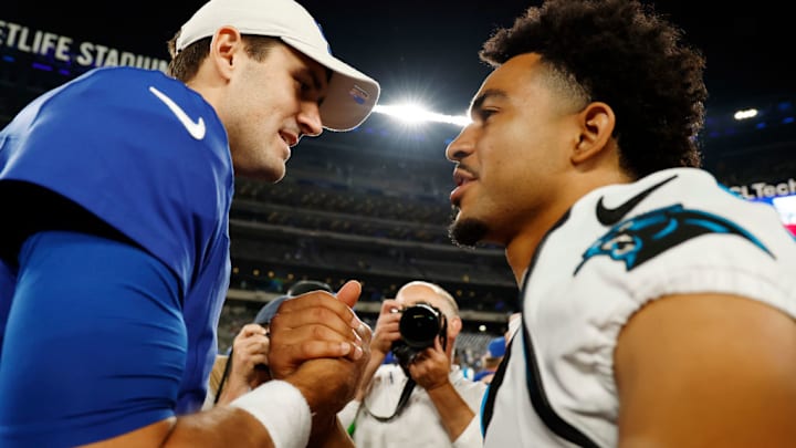 EAST RUTHERFORD, NEW JERSEY - AUGUST 18: Daniel Jones #8 of the New York Giants greets Bryce Young #9 of the Carolina Panthers after the second half of a preseason game at MetLife Stadium on August 18, 2023 in East Rutherford, New Jersey. The Giants won 21-19.