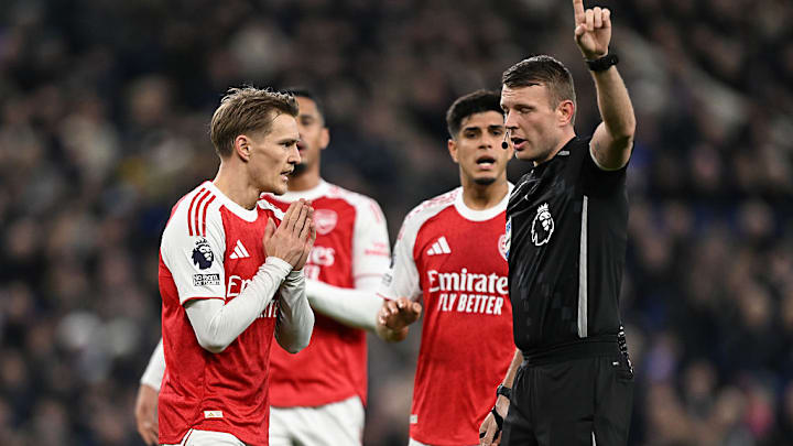 Referee Sam Barrett (right) did not award Everton a penalty against Arsenal.