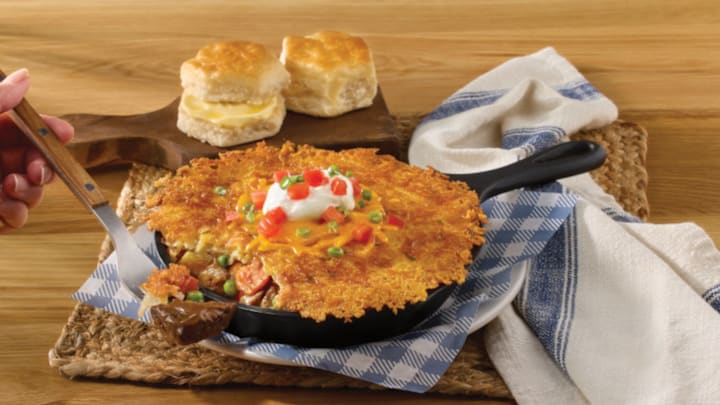 New Hashbrown Cassrole Shepherd's Pie includes slow-simmered pot roast in a savory sauce with carrots, peas and mashed potatoes topped with a griddled hashbrown casserole crust and sour cream. Served with choice of hand-rolled buttermilk biscuits or corn muffins. *Available at select locations only.