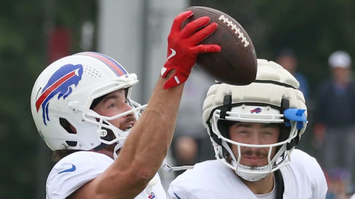 Bills tight end Dawson Knox eyes in a one-handed catch over Dalton Kincaid during position drills during day seven of Buffalo Bills training camp at St. John Fisher University Thursday, July 31, 2025 in Pittsford, NY. This was the first day Knox took part in camp with full pads on.