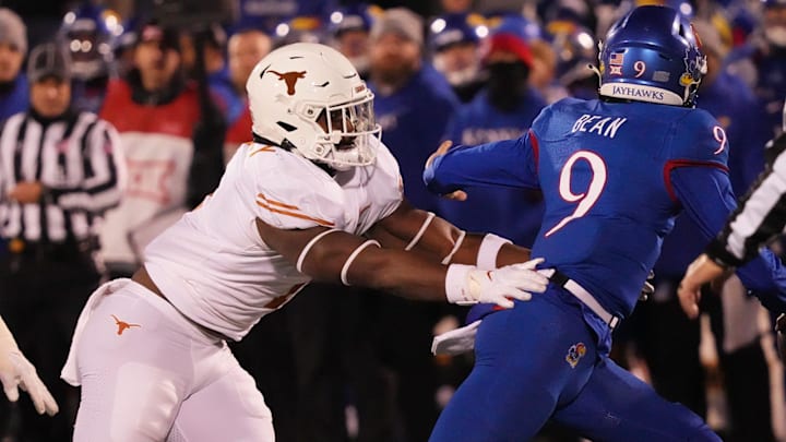 Texas Longhorns defensive end Justice Finkley (1) pressures Kansas Jayhawks quarterback Jason Bean (9)  during the Texas Longhorns football game against the Kansas Jayhawks in Lawrence, Kansas on Saturday, Nov. 19, 2022.

Ut Ku Football Mlc 01255