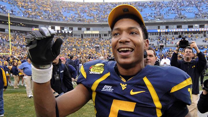 Dec. 27, 2008; Charlotte, NC, USA; West Virginia Mountaneers  quarterback Pat White (5) reacts after the Mountaineers 31-30 victory against the North Carolina Tar Heels at Bank of America Stadium. Mandatory Credit: Bob Donnan-Imagn Images