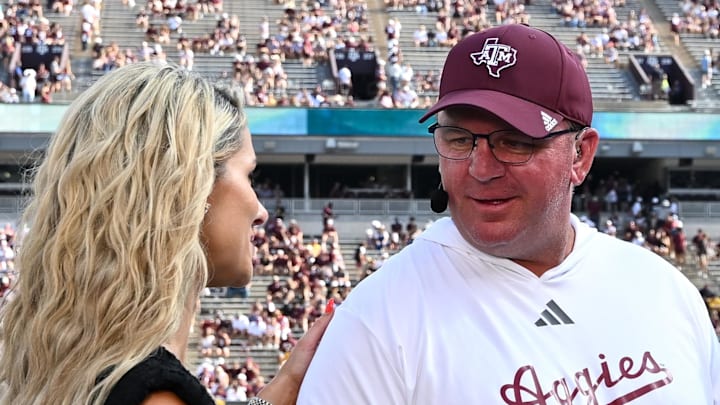 Oct 5, 2024; College Station, Texas, USA; SEC Nation host Laura speaks with Texas A&M Aggies head coach Mike Elko prior to the game between the Texas A&M Aggies and the Missouri Tigers at Kyle Field. Mandatory Credit: Maria Lysaker-Imagn Images. Oct 5, 2024; College Station, Texas, USA; SEC Nation host Laura speaks with Texas A&M Aggies head coach Mike Elko prior to the game between the Texas A&M Aggies and the Missouri Tigers at Kyle Field. Mandatory Credit: Maria Lysaker-Imagn Images.