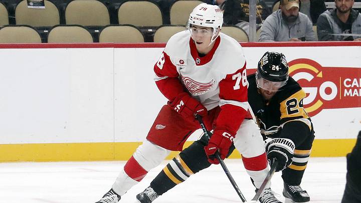 Oct 1, 2024; Pittsburgh, Pennsylvania, USA;  Detroit Red Wings center Amadeus Lombardi (78) skates in on goal against Pittsburgh Penguins defenseman Matt Grzelcyk (24) during the second period at PPG Paints Arena. Mandatory Credit: Charles LeClaire-Imagn Images