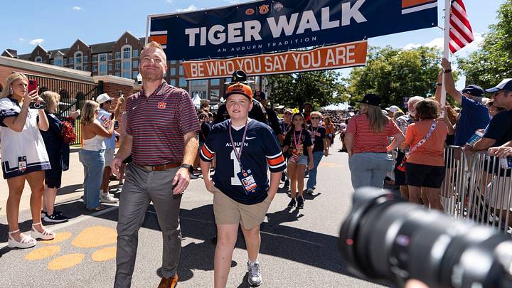 Auburn Tigers head coach Alex Golesh greets fans during Tiger Walk before Auburn Tigers take on  Vanderbilt Commodores at Jordan-Hare Stadium in Auburn, Ala. on Saturday, Sept. 26, 2026.