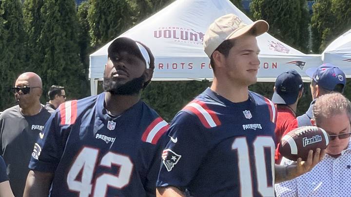 New England Patriots quarterback Drake Maye (10) and linebacker Jesse Luketa (42) help out at the team's community day. New England Patriots quarterback Drake Maye (10) and linebacker Jesse Luketa (42) help out at the team's community day.