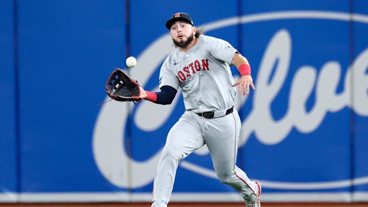 Sep 19, 2024; St. Petersburg, Florida, USA; Boston Red Sox outfielder Wilyer Abreu (52) catches a fly ball against the Tampa Bay Rays in the third inning at Tropicana Field. Mandatory Credit: Nathan Ray Seebeck-Imagn Images Sep 19, 2024; St. Petersburg, Florida, USA; Boston Red Sox outfielder Wilyer Abreu (52) catches a fly ball against the Tampa Bay Rays in the third inning at Tropicana Field. Mandatory Credit: Nathan Ray Seebeck-Imagn Images