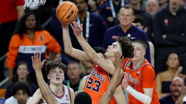 Apr 4, 2026; Indianapolis, IN, USA; Illinois Fighting Illini guard Keaton Wagler (23) goes to the basket against UConn Huskies guard Silas Demary Jr. (2) in the second half during a semifinal of the Final Four of the men's 2026 NCAA Tournament at Lucas Oil Stadium. Mandatory Credit: Trevor Ruszkowski-Imagn Images