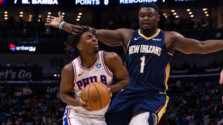 Nov 29, 2023; New Orleans, Louisiana, USA; Philadelphia 76ers guard Tyrese Maxey (0) dribbles against New Orleans Pelicans forward Zion Williamson (1) during the first half at the Smoothie King Center. Mandatory Credit: Stephen Lew-Imagn Images