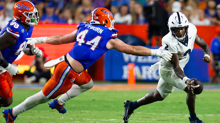 Florida Gators edge Jack Pyburn (44) chases down Samford Bulldogs quarterback Quincy Crittendon (2) during the first half at Ben Hill Griffin Stadium in Gainesville, FL on Saturday, September 7, 2024 against the Samford Bulldogs. The Gators lead 14-0 at the half. [Doug Engle/Gainesville Sun]