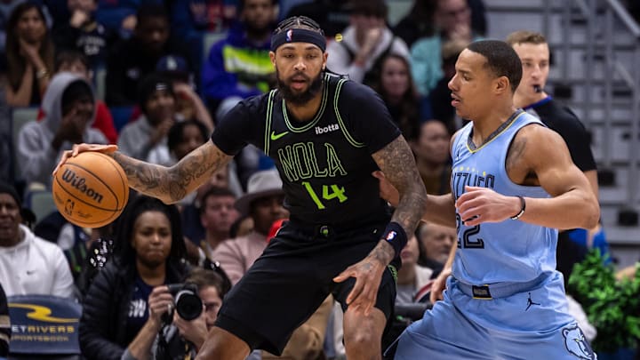 Dec 26, 2023; New Orleans, Louisiana, USA; New Orleans Pelicans forward Brandon Ingram (14) dribbles against Memphis Grizzlies guard Desmond Bane (22) during overtime at Smoothie King Center. Dec 26, 2023; New Orleans, Louisiana, USA; New Orleans Pelicans forward Brandon Ingram (14) dribbles against Memphis Grizzlies guard Desmond Bane (22) during overtime at Smoothie King Center.